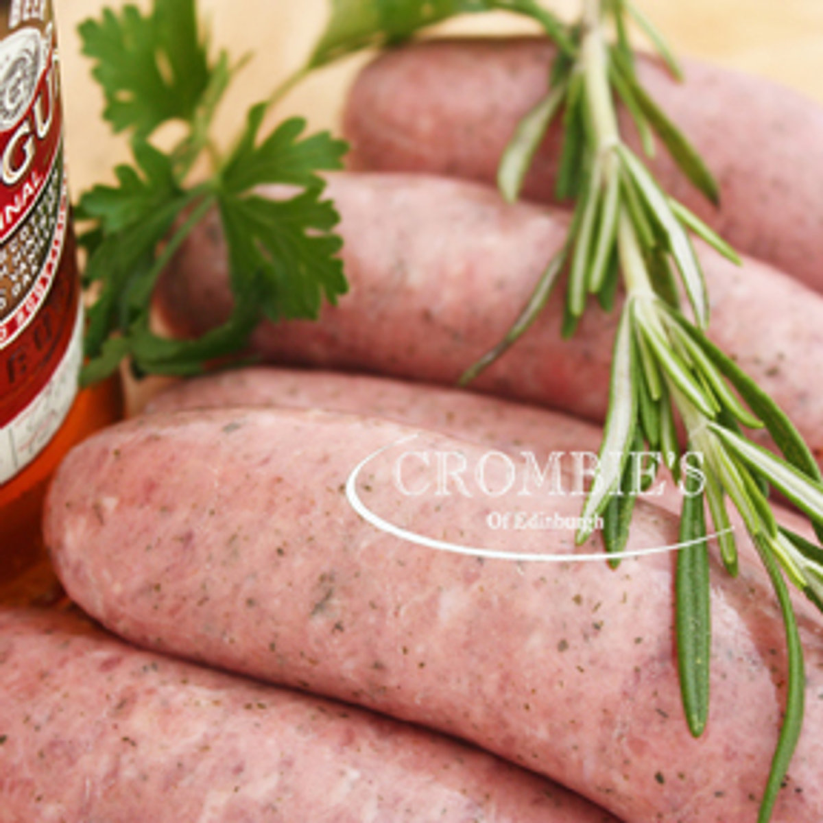 Crombies sausages with a sprig of rosemary and a jar of preserve