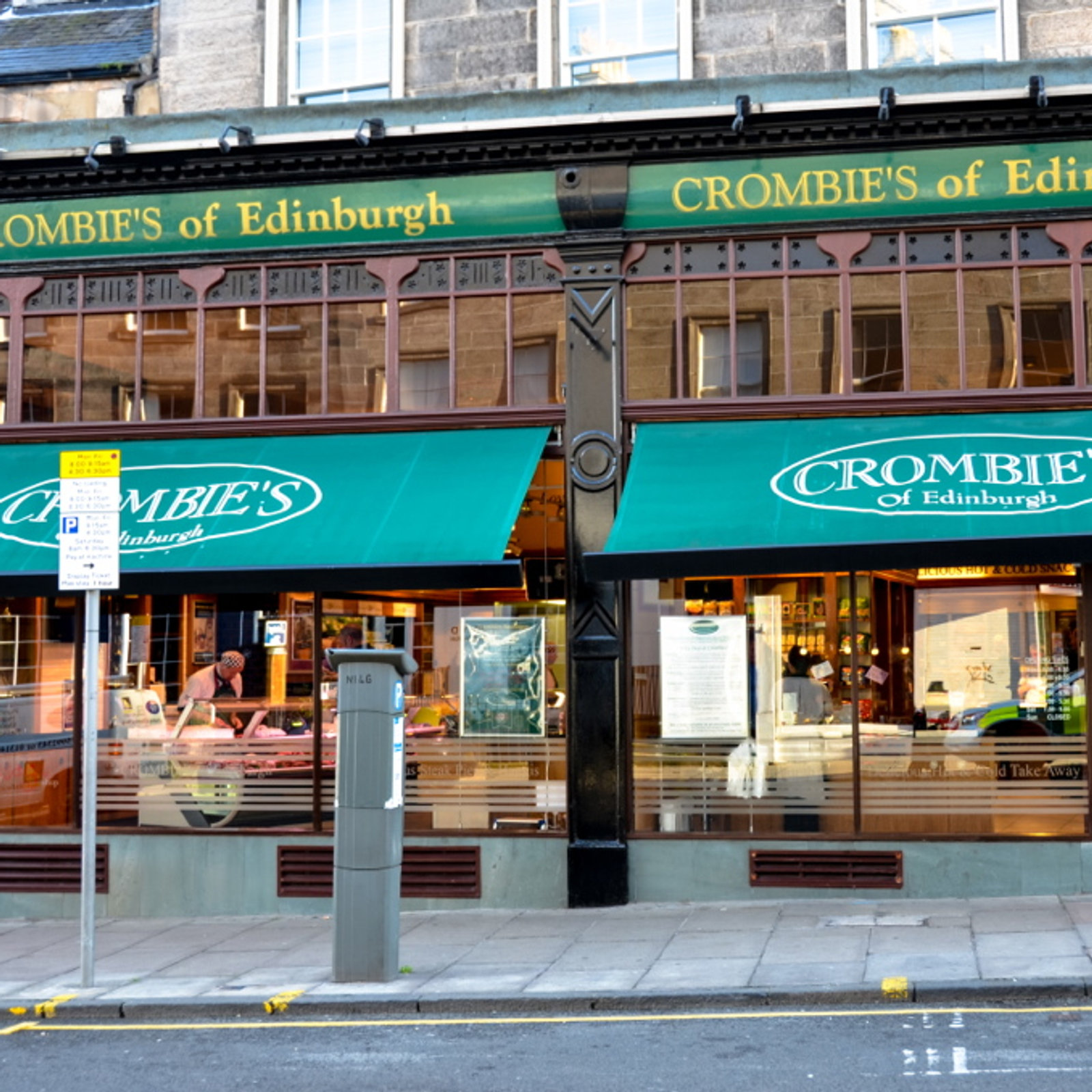 A former Crombies shopfront on Broughton Street with a turquoise fascia lettered Crombie's of Edinburgh